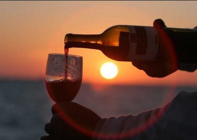 Wine being poured during a Key West Sunset Cruise