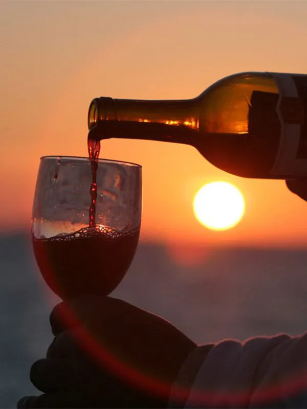 Pouring a glass of wine during a Key West Sunset Cruise