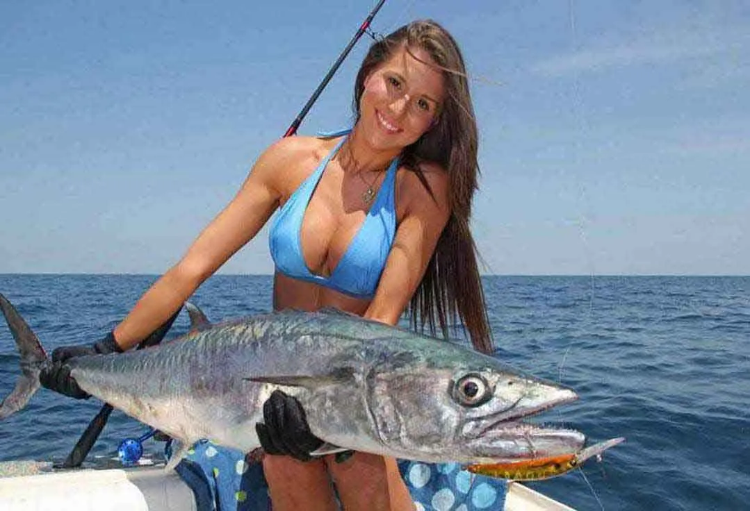 Girl with Wahoo during a Key West deep sea fishing Trip