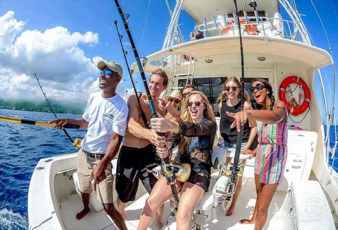 a group of people having fun on a key west deep sea fishing charters trip
