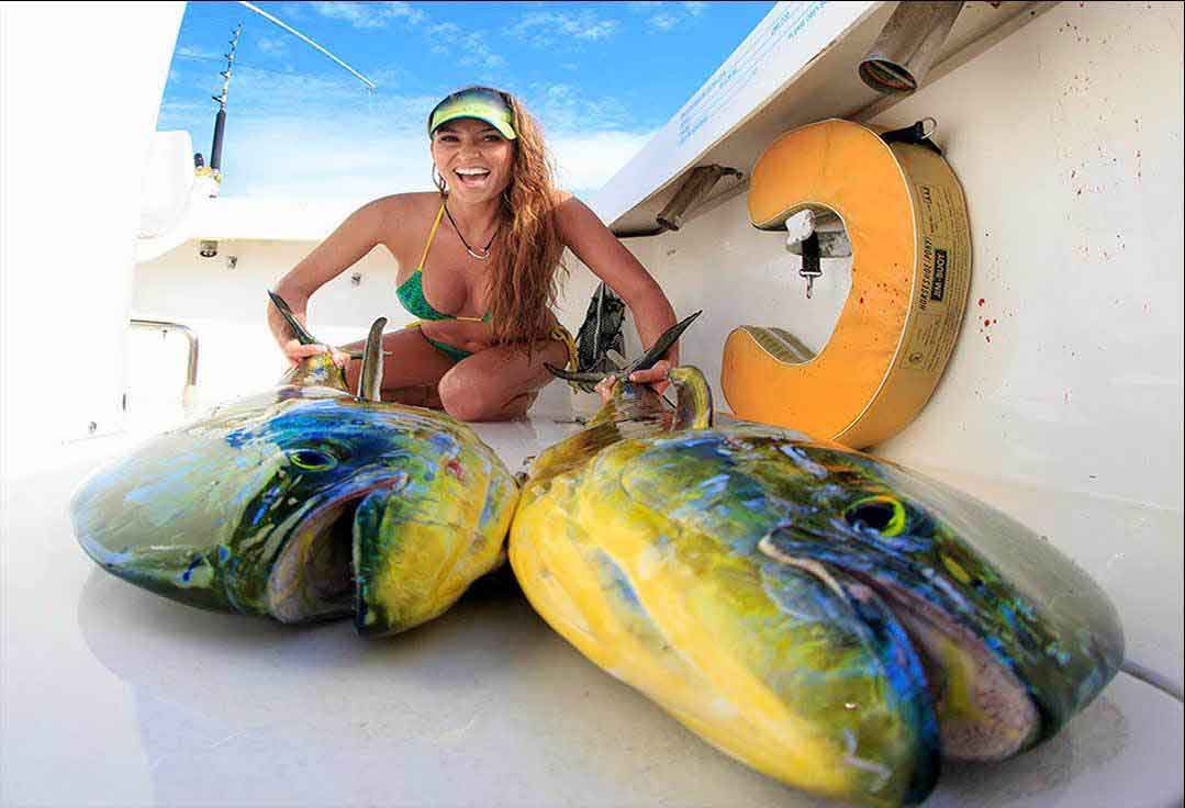girl displays her mahi-mahi with key west deep sea fishing