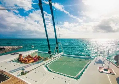 Relaxing in sailboat catamarans trampoline with Key West Sailing