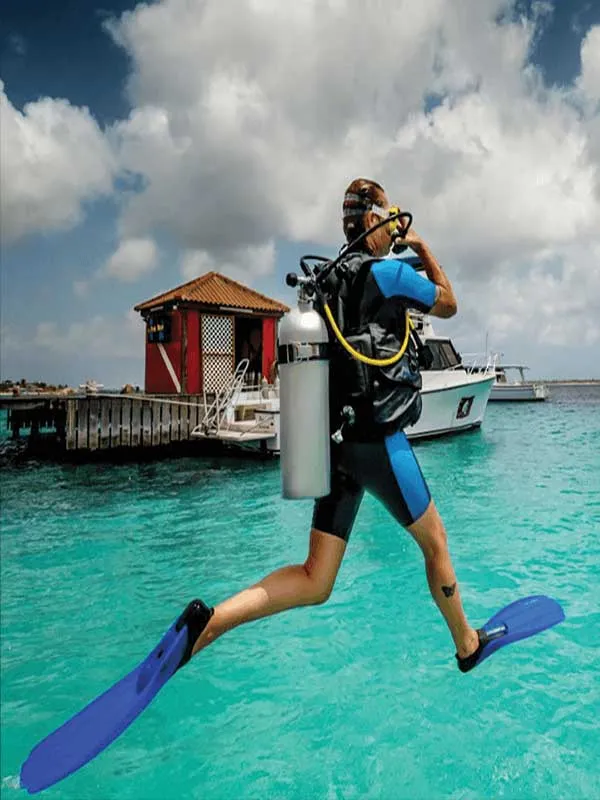 woman giant strides into the water with Key West Scuba Diving