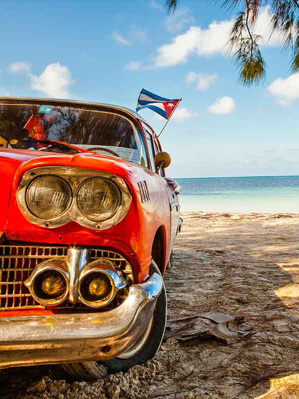 a hot rod at a Caribbean beach with Key West To Cuba