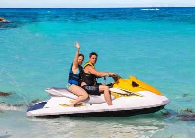 Couple Waves a Hand on Key West Jet Ski Rental