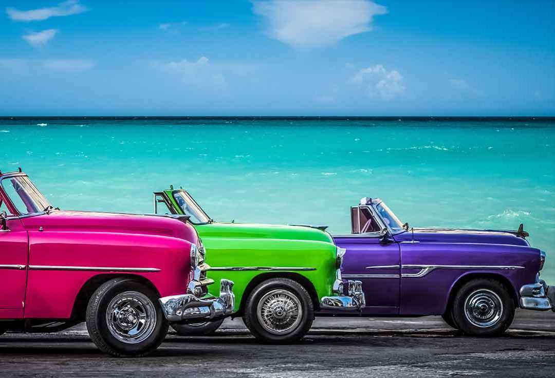 A cuban hot rod cruises during Key West SCUBA diving Cuba trip